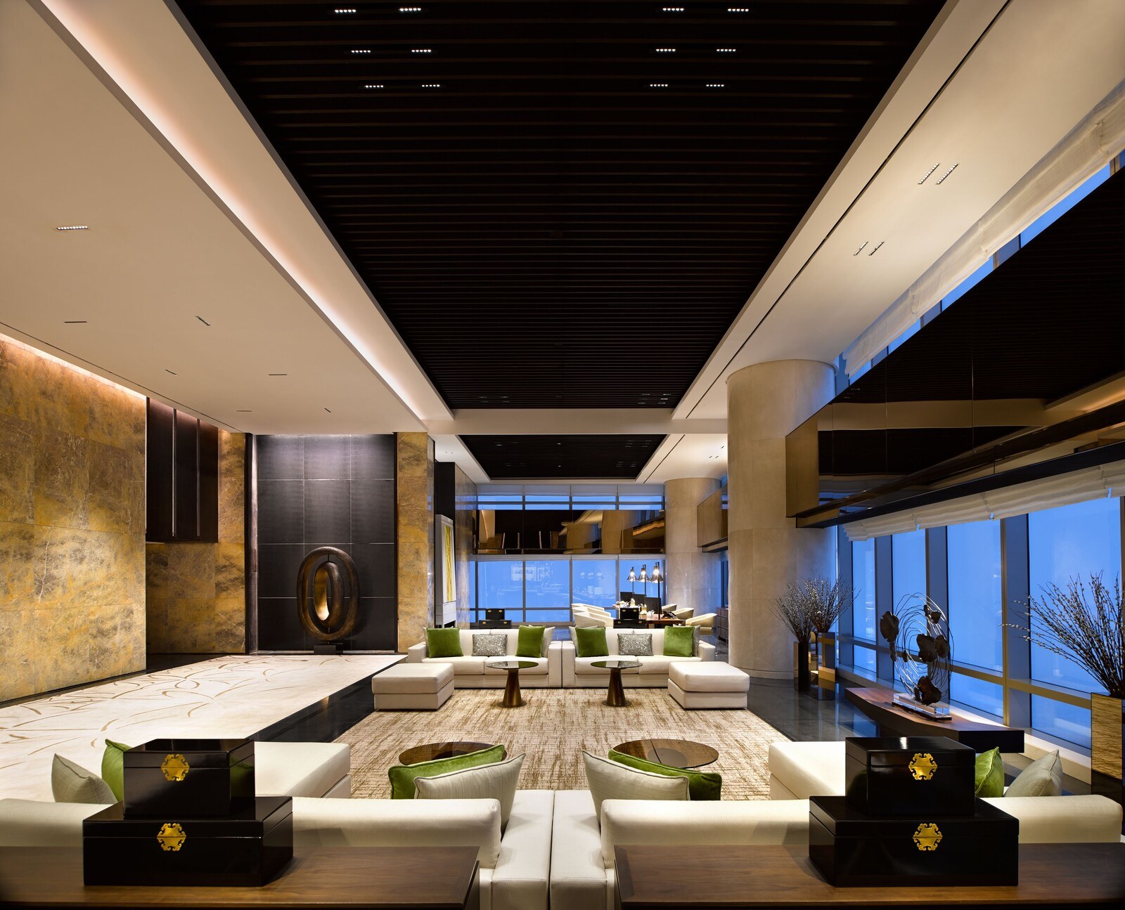 A modern lobby with a high ceiling, large windows, and a seating area with sofas and a coffee table. - Lotte Hotel Hanoi (Hanoi)
