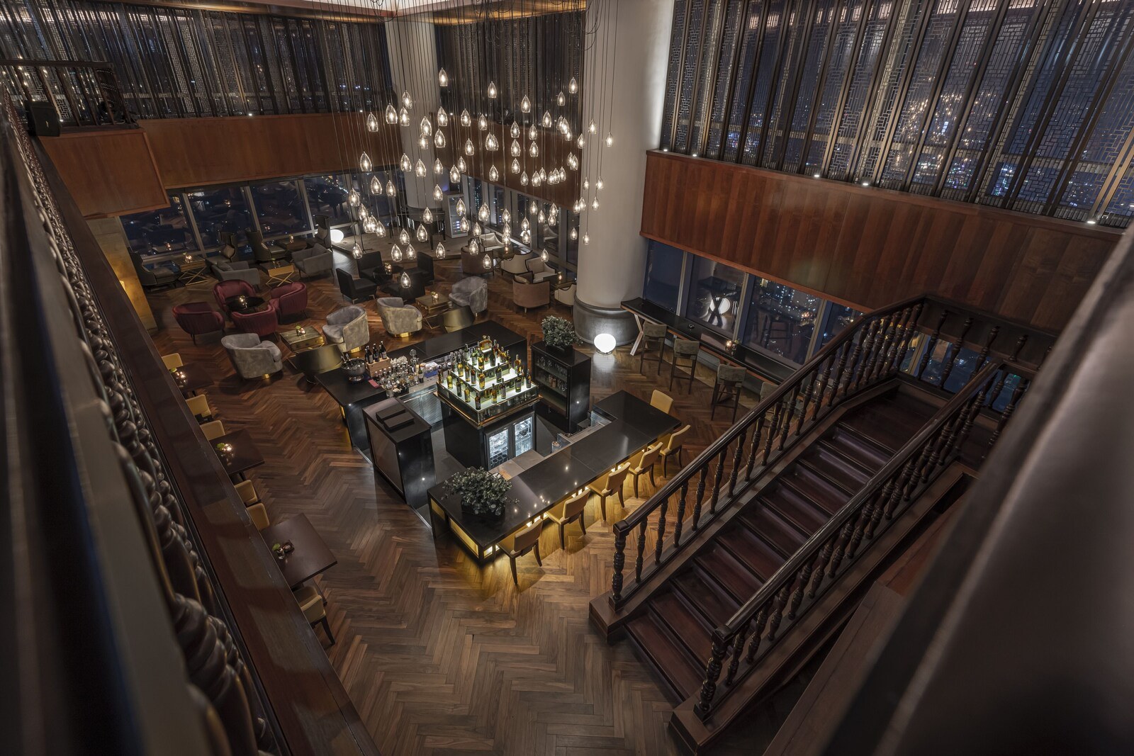 A spacious lobby with a bar area, seating arrangements, and a staircase. - Lotte Hotel Hanoi (Hanoi)
