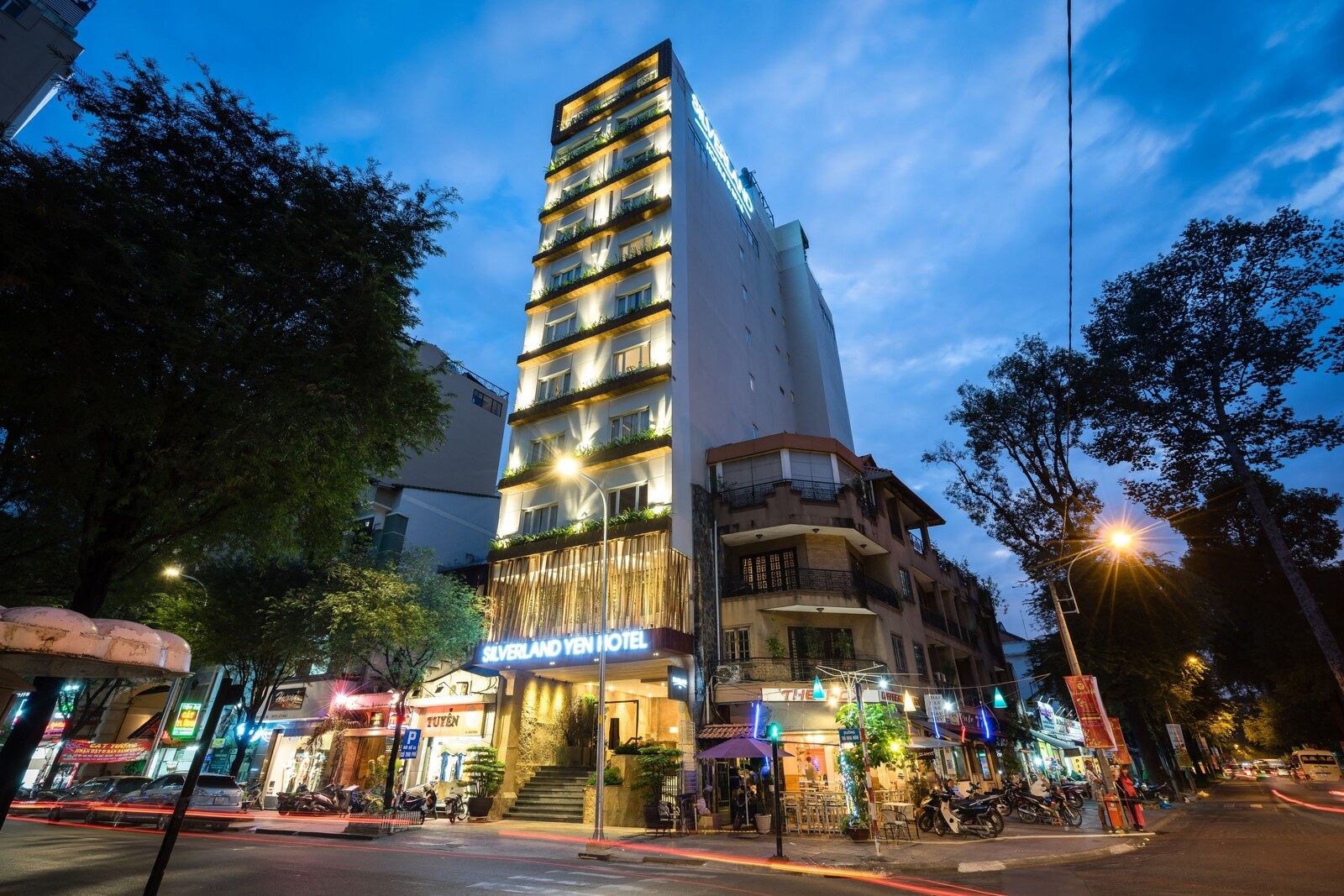 A multi-story hotel with a modern design, featuring balconies on each floor and a prominent entrance. - Silverland Yen Hotel (Ho Chi Minh City)