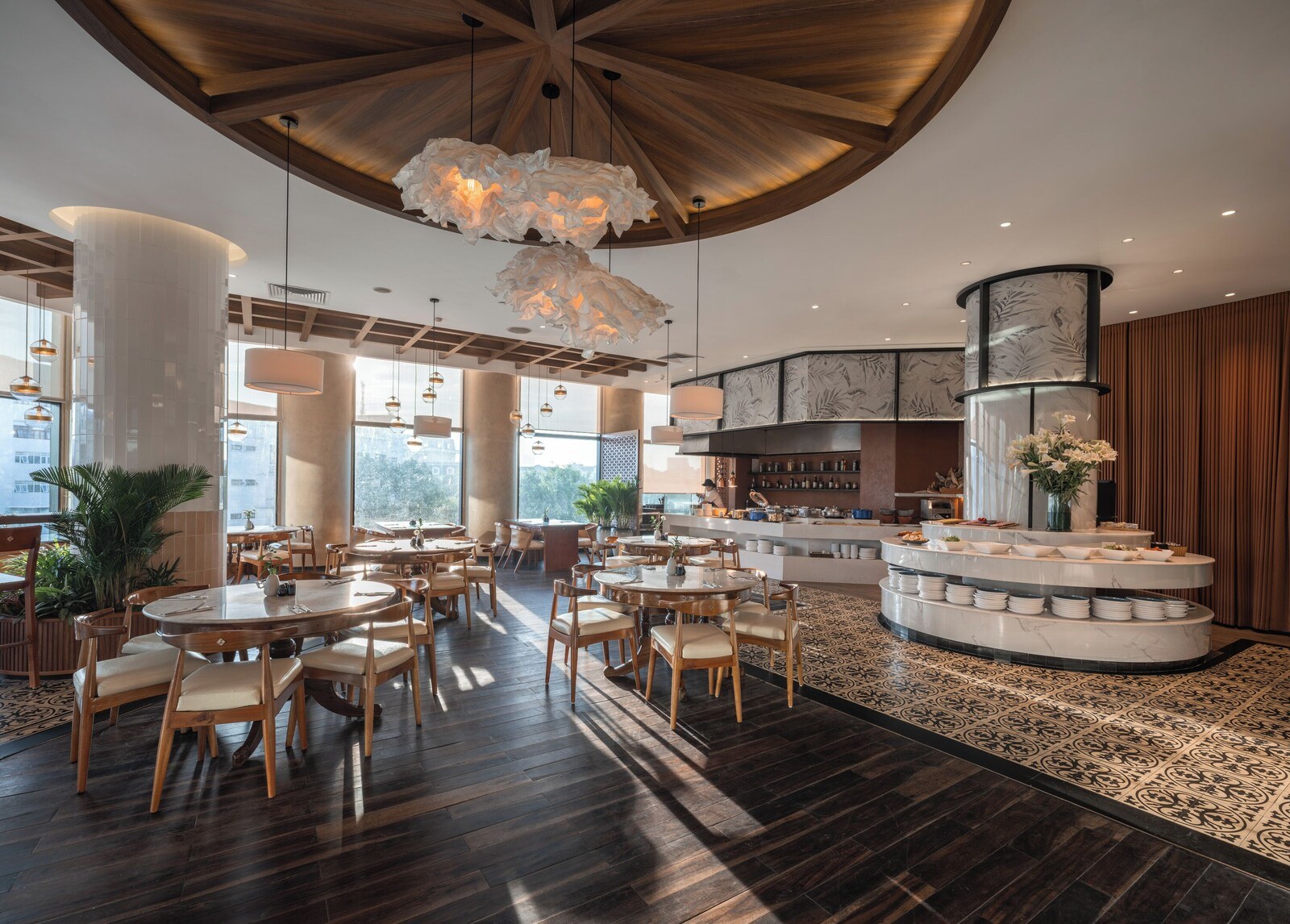 A spacious restaurant with high ceilings, wooden beams, and modern lighting fixtures. - Somerset Grand Hanoi (Hanoi)